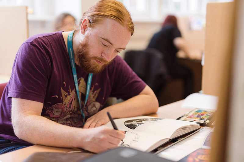 An illustration student working
